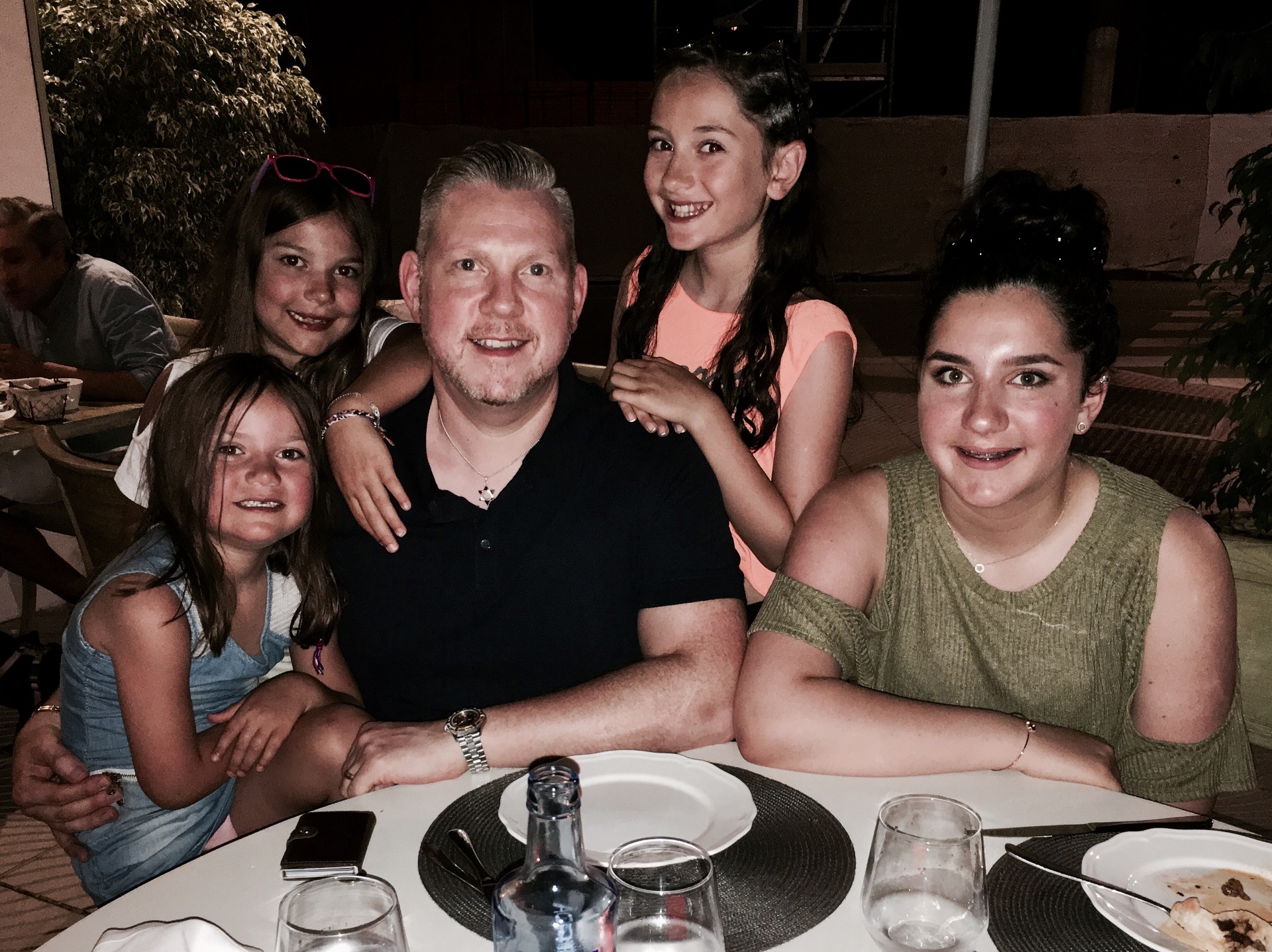 Paul Harris with his four daughters